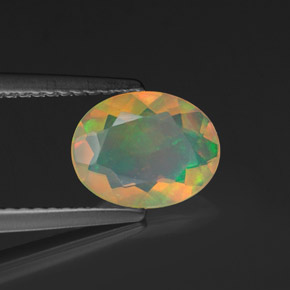 Opale naturale multicolore da 0,90 ct, taglio ovale, trasparente