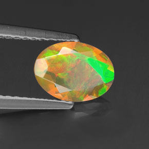 Opale naturale multicolore da 0,69 ct, taglio ovale, trasparente