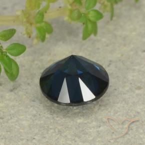 Zaffiro Blu nerastro naturale da 0.63 ct, Rotondo, VVS-VS