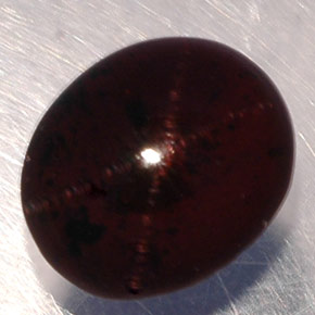 Granato stellato naturale nero rossastro da 5,02 ct, taglio ovale, traslucido