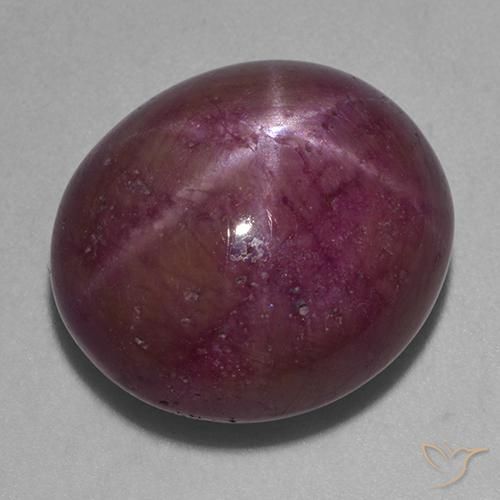 Rubino Stellato Magenta grigiastro naturale da 21.97 ct, Ovale, Opaco