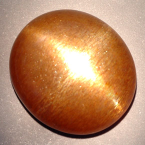Pietra del sole stellata marrone dorato naturale da 23,28 ct, taglio ovale, opaco