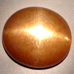 Pietra del sole stellata marrone dorato naturale da 23,28 ct, taglio ovale, opaco