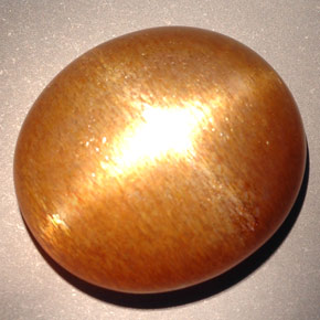Pietra del sole stellata marrone dorato naturale da 23,28 ct, taglio ovale, opaco