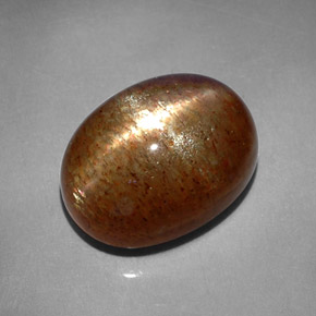 Pietra del sole stellata naturale marrone da 8,41 ct, taglio ovale, opaco