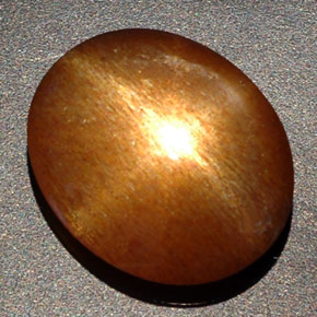 Pietra del sole stellata naturale marrone da 8,09 ct, taglio ovale, opaco