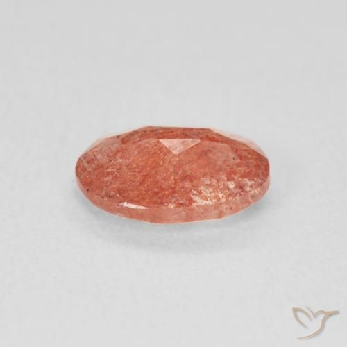 Pietra solare Arancione rossastra naturale da 0.91 ct, Ovale, Traslucido