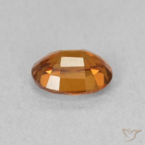 Zircone Arancione scuro naturale da 0.60 ct, Ovale, VVS-VS