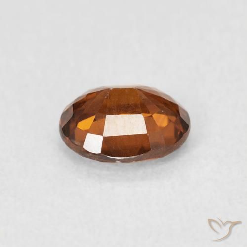 Zircone Arancione rossastra naturale da 0.94 ct, Ovale, VS