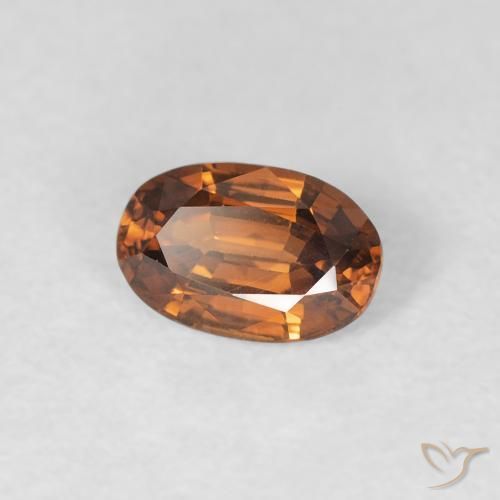 Zircone Arancio brunastro intenso naturale da 0.67 ct, Ovale, VVS