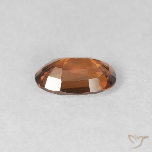 Zircone Arancio brunastro intenso naturale da 0.67 ct, Ovale, VVS