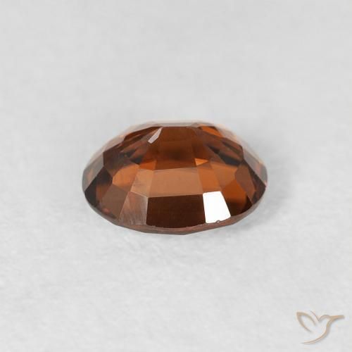 Zircone Arancio brunastro intenso naturale da 0.99 ct, Ovale, VS